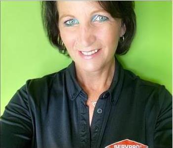 SERVPRO crew - female employee with dark hair