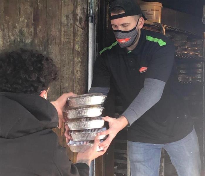 Loading meals on truck for the needy